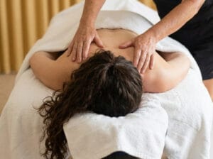 Client receiving nurturing remedial massage to the upper back at Body Nurture Massage Ballarat.
