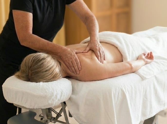Woman receiving a nurturing remedial massage session at Body Nurture Massage in Ballarat, focusing on shoulders and upper back.